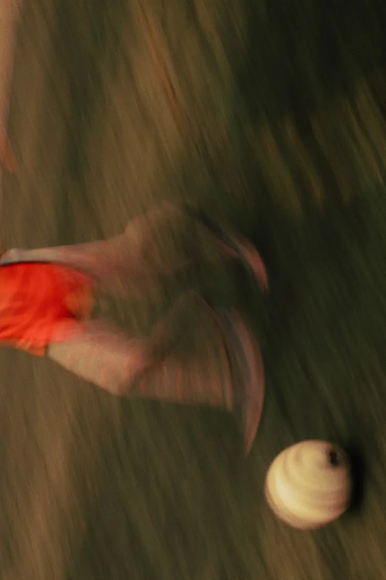 A photo of players kicking a football.